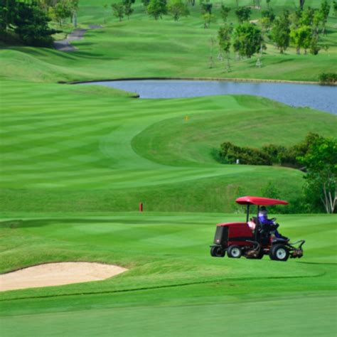 mowing a golf course with skid steer|Golf Course Maintenance Equipment Rentals I Sunstate Equipment.